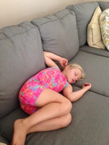 Vivi, age 7, fast asleep on the couch (June 2016).